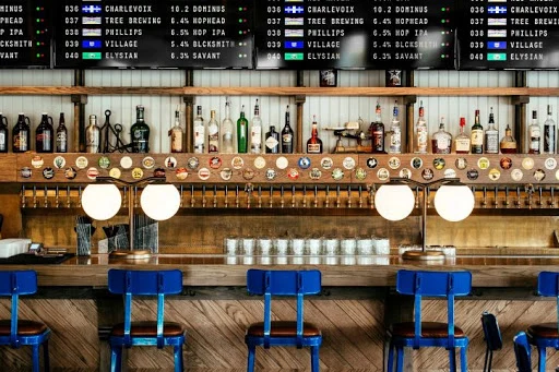 Menuat digital boards above a bar